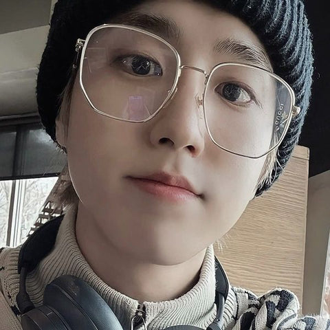 South Korean rapper Han Jisung of K-Pop group Stray Kids was seen wearing Gucci GG0396S 001 Gold sunglasses in a social media post.