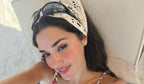 Turkish actress Hande Ercel wore black Miu Miu MU C06SU 16K80Q sunglasses in her Instagram post, July 2026.