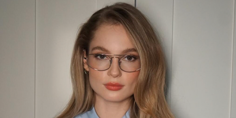 Actress Hannah Dodd was seen wearing gold Ray-Ban Explorer 5 RB 6545 3086 optical glasses in her Instagram post, January 2026.