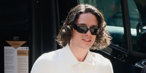 Celebrity and actor Harry Collett was seen wearing black Prada PR 17WS 1AB5S0 Symbole Sunglasses in New York City, June 2024.