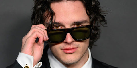 Celebrity actor Harry Collett was seen wearing havana tortoise Prada PR B12S 17N20G Polarised sunglasses with green lenses at the HBO Max UK & Ireland launch event in London, March 2026.