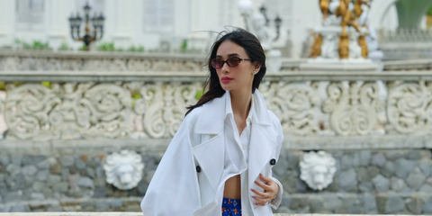 Heart Evangelista was seen wearing tortoiseshell Miu Miu MU 04ZS VAU50D oval sunglasses with pink red lenses