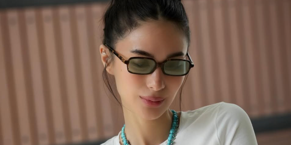 Heart Evangelista was seen wearing tortoise Miu Miu MU 11ZS VAU04M rectangular sunglasses with green mirror lenses in her Instagram post, April 2026.