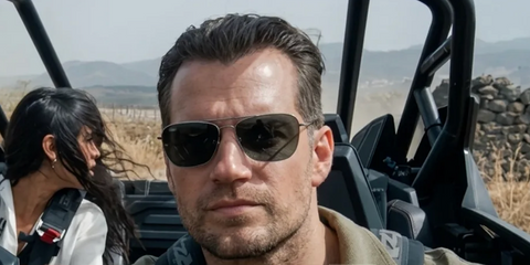 Henry Cavill was seen wearing gunmetal Ray-Ban Caravan Reverse RB R0102S 004/GR sunglasses with grey lenses in 2026 movie In The Grey.
