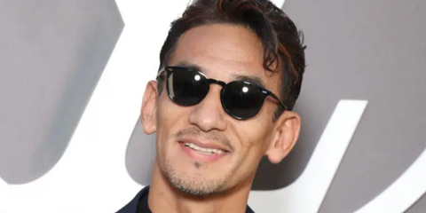 Hidetoshi Nakata was seen wearing black Oliver Peoples N.02 Sun OV5529SU 1731/R5 round sunglasses to attend Louis Vuitton Spring/Summer 2025 fashion show during Paris Fashion Week