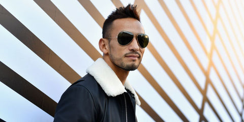 Hidetoshi Nakata was seen wearing silver Ray-Ban Aviator Large Metal RB 3025 9190/31 sunglasses