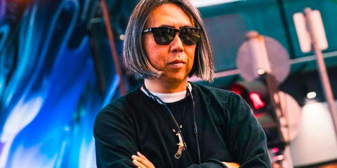 Hiroshi Fujiwara was seen wearing blackOakley Frogskins Lite OO9374 49 half-rim sunglasses with gradient Prizm Polarised lenses in a Hypebeast feature, 2023