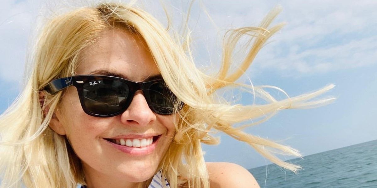 British television presenter Holly Willoughby was seen wearing Ray-Ban New Wayfarer 2132 901/58 Polarised sunglasses