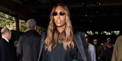 DJ Honey DIjon was seen wearing gold Bottega Veneta BV1330S 003 sunglasses with brown lenses at the Bottega Veneta Spring/Summer 2026 fashion show during Milan Fashion Week. Shop online now on Pretavoir
