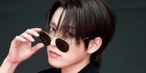 South Korean rapper and singer Hongjoong of K-Pop group ATEEZ was seen wearing gold Ray-Ban RB 3647N 001 Round Double Bridge sunglasses during a photo shoot for 'In Your Fantasy Edition' music video.
