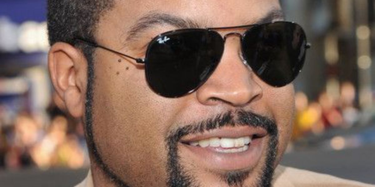 Ice Cube was seen wearing Ray-Ban Aviator RB 3025 L2823 Black sunglasses 
 with Green lenses