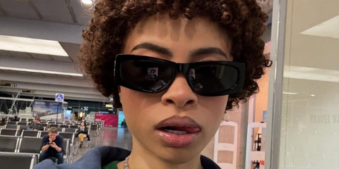 Ice Spice was seen wearing black Saint Laurent SL M140 001 rectangular sunglasses in her Instagram post
