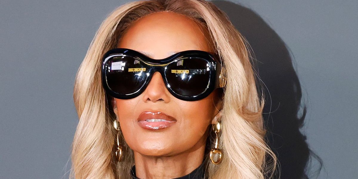 Supermodel Iman was seen wearing black Gucci GG2275S 001 round sunglasses at the Gucci Cruise 2027 fashion show in Times Square, New York City.