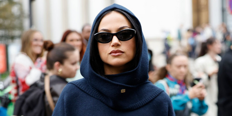 Canadian actress and YouTuber Inanna Sarkis was seen wearing black Prada PR 26ZS 16K08Z cat eye sunglasses during Paris Fashion Week season Spring/Summer 2025. Shop online now on Pretavoir