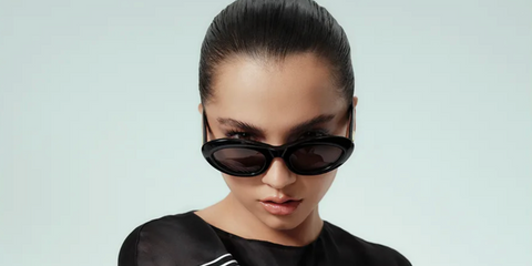 Isabela Merced was seen wearing black Bottega Veneta BV1191S 001 sunglasses in an interview with Who What Wear