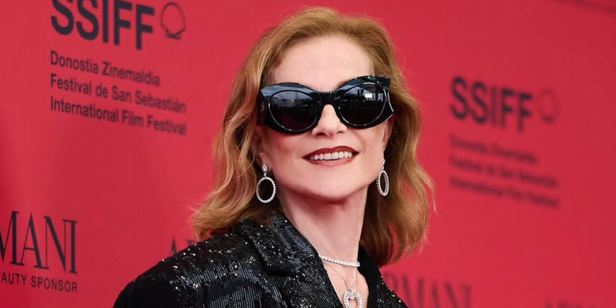 Isabelle Huppert wears Balenciaga BB0256S 001 hourglass sunglasses to the 2024 San Sebastian International Film Festival