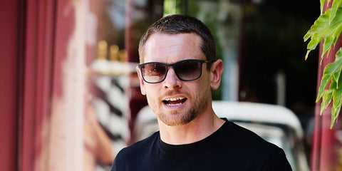 Jack O'Connell was seen wearing black Prada Linea Rossa SPS 06Y 1AB09U sunglasses with grey gradient lenses at the 83rd Venice Film Festival in September 2026.