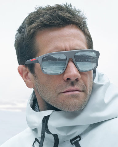Jake Gyllenhaal was seen wearing metal grey Prada Linea Rossa SPS B02 16X7W1 sunglasses in the Prada Linea Rossa Eyewear 2025 campaign.