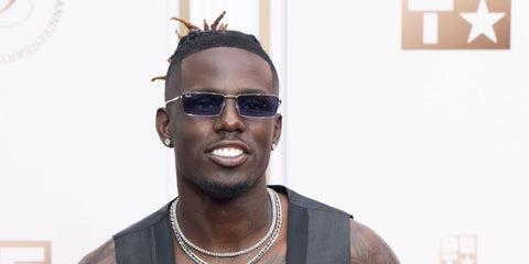 Singer and American Idol season 23 winner Jamal Roberts was seen wearing silver Ray-Ban Emy RB 3741 003/80 sunglasses with blue lenses at the BET Awards 2025.
