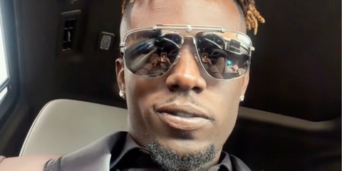 Singer and American Idol season 23 winner Jamal Roberts was seen wearing gunmetal Versace 2242 1001/6G sunglasses with silver mirror lenses in his Instagram reel, April 2026.