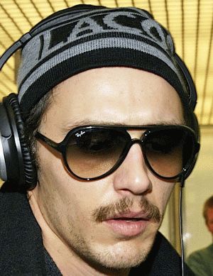 James Franco was seen wearing black Ray-Ban Cats 5000 RB 4125 601/32 sunglasses with brown gradient lenses