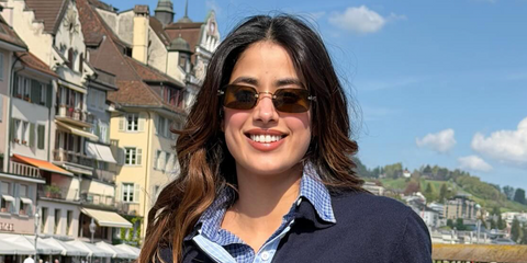 Bollywood actress Janhvi Kapoor was seen wearing gold Miu Miu MU B50S 26C09Z rectangular sunglasses with dark brown lenses in Switzerland, April 2026.