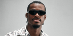 Basketball player Jarred Vanderbilt of the Los Angeles Lakers was seen wearing black Prada PR C02S 16K08Z sunglasses at the Prada Menswear Spring/Summer 2027 fashion show during Milan Men's Fashion Week.
