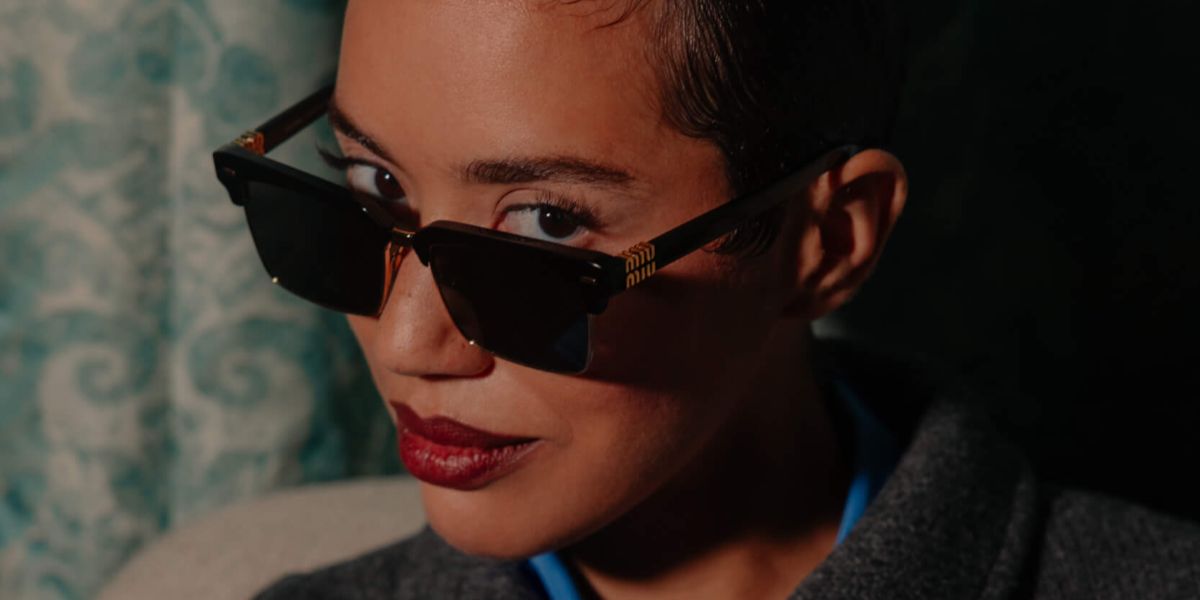 Actress Jasmin Savoy Brown was seen wearing black Miu Miu MU 10ZS 1AB5S0 alf-rim sunglasses in a The Italian Reve Magazine feature, September 2024. Shop online now on Pretavoir