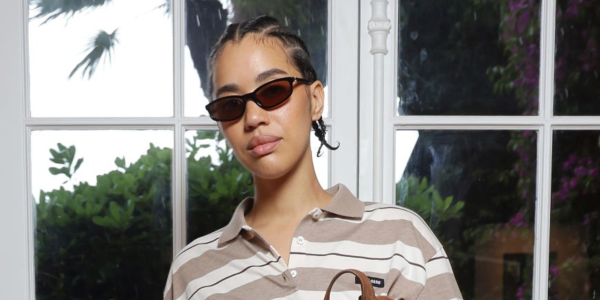 Actress Jasmin Savoy Brown was seen wearing black Miu Miu MU A06S 16K10I sunglasses with brown lenses at the "Grande Envie" Miu Miu Lunch in Antibes, France, May 2025. Shop online now on Pretavoir