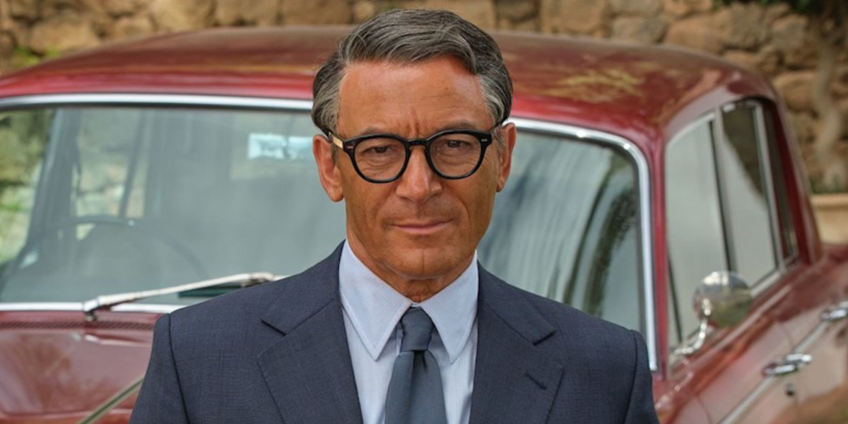 Jason Isaacs was seen wearing black Oliver Peoples Sheldrake OV5036 1492 optical glasses in 2023 series Archie as Cary Grant
