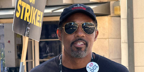 Actor Jason Winston George was seen wearing gold Ray-Ban Aviator RB 3025 9196/48 sunglasses with black Polarised lenses at the SAG AFTRA Strike in 2023.