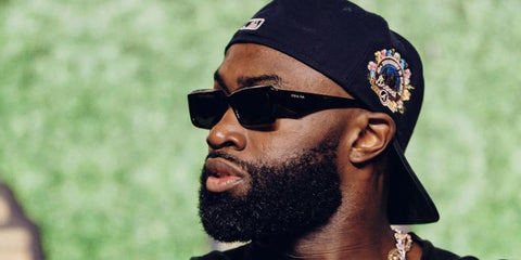 Jaylen Brown was seen wearing black Prada PR 27ZS 16K08Z sunglasses in his Instagram post, August 2025.