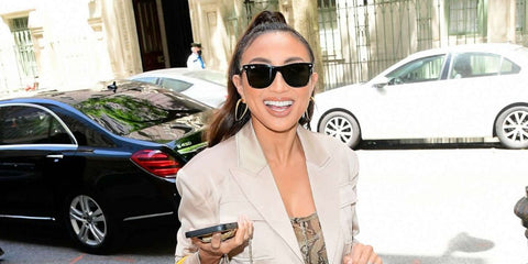 Jeannie Mai was seen wearing black Ray-Ban Blaze Wayfarer RB 4440N 601/71 sunglasses outside Good Morning America studios