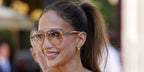 Jennifer Lopez was seen wearing gold Bottega Veneta BV1305S 002 Sardine aviator sunglasses during Paris Haute Couture Week.