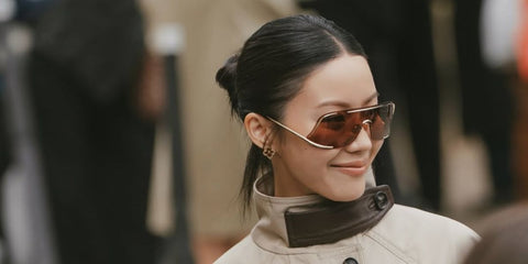 Influencer and designer Jenny Tsang was seen wearing gold Loewe Signature LW40193U 30S shield sunglasses with red brown lenses in Milan, October 2025.