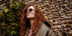 Jess Glynne was seen wearing gold Prada PR B53S 5AK09Z sunglasses in her Instagram post, September 2025.