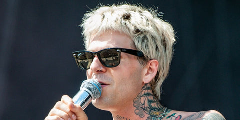 Former actor and singer-songwriter Jesse Rutherford of The Neighbourhood band was seen wearing the iconic Ray-Ban Wayfarer 2140 901/58 sunglasses with green Polarised lenses in 2018.