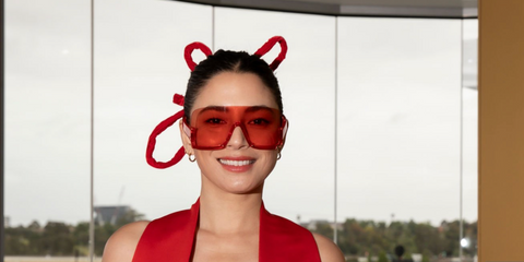 Australian model Jessica Gomes was seen wearing red Gucci GG1631S 001 shield sunglasses at the Melbourne Cup 2023.
