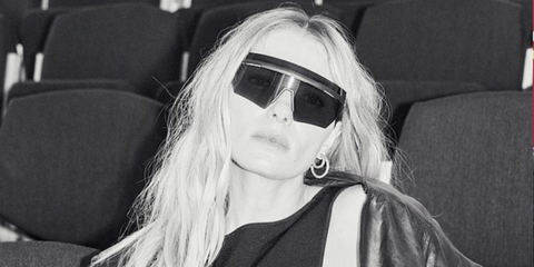 Australian model Jessica Hart was seen wearing black Prada Linea Rossa SPS 01Y 1BO06F shield sunglasses in an Harper's Bazaar Australia digital story 2024, photographed by Pierre Toussaint.