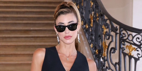 Model and actress Jessica Serfaty was seen wearing the iconic Ray-Ban Wayfarer 2140 901 Black sunglasses at the the A$AP Rocky X American Sabotage by AWGE Menswear Spring/Summer 2025 fashion show during Paris Men's Fashion Week.
