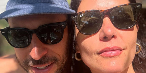 Singer-songwriter Jessie Ware, pictured with husband Sam Burrows, was seen wearing tortoiseshell Ray-Ban Wayfarer II RB 2185 902/31 sunglasses in Greece, shared through her Facebook post in August 2024.