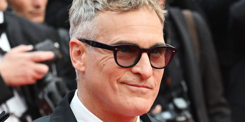 Joaquin Phoenix was seen wearing black Oliver Peoples N.01 OV5528U 1731 glasses at the 2025 Cannes Film Festival
