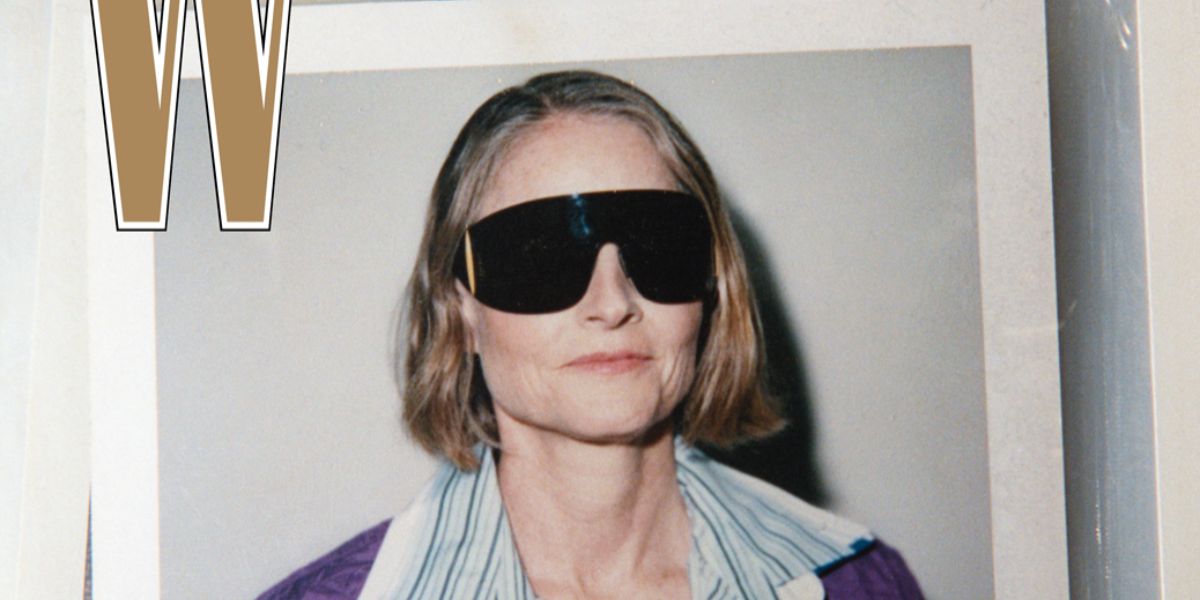 Jodie Foster was seen wearing black Loewe Signature LW40202U 02A shield visor sunglasses with yellow details in a W Magazine Best Performances Issue, January 2026.