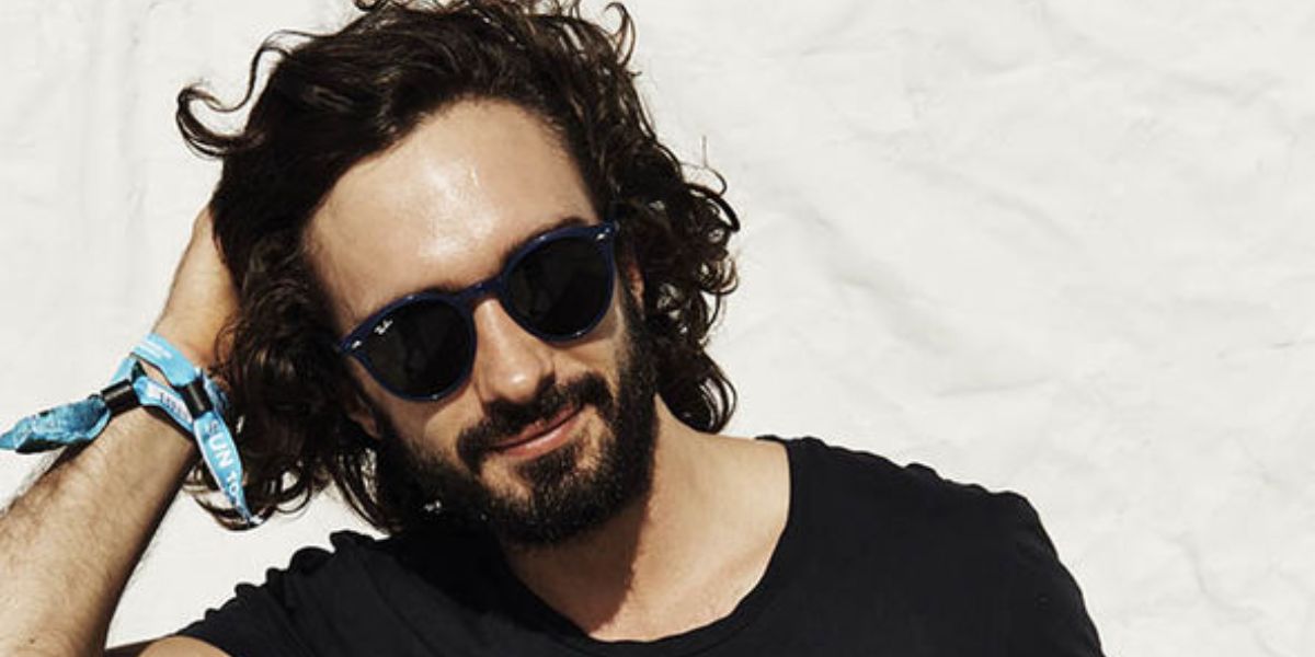 British fitness coach Joe Wicks was seen wearing Ray-Ban RB 2180 601/71 round sunglasses
