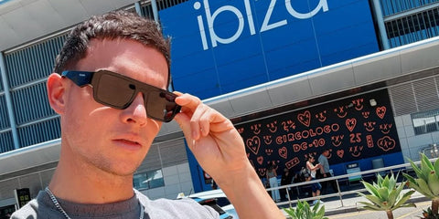 Joel Corry is seen wearing Prada PR A05S 16K08Z sunglasses in his Facebook post