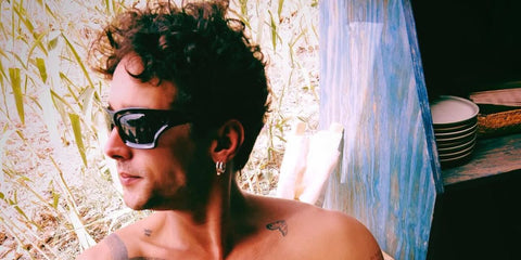 Model and television personality Joel Sanchez was seen wearing black Loewe x Paula's Ibiza LW40143U 01A sunglasses in his Instagram post, July 2024.