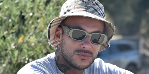 French DJ and producer Joezi was seen wearing sage green Prada PR 17WS 13N5S0 Symbole sunglasses in his Instagram post.