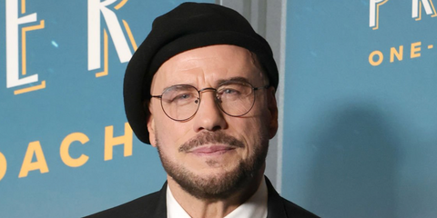 Actor John Travolta was seen wearing black Ray-Ban Round Metal RB 3447V 2509 optical glasses at the Los Angeles Premiere Apple Original Film "Propeller One-Way Night Coach".