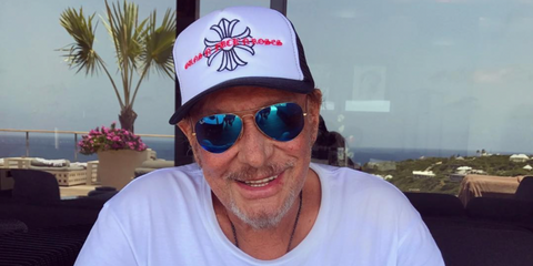 The late French rock star Johnny Hallyday was seen wearing gold Ray-Ban Aviator 3025 112/4L Polarised Blue Mirror sunglasses in his Instagram post. Shop online now on Pretavoir