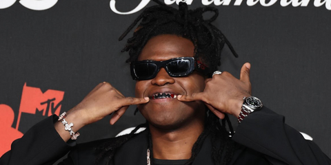 Northern Irish musician Jordan Adetunji was seen wearing black Prada PR A01S 16K08Z sunglasses at the MTV Video Music Awards 2025. Shop online now on Pretavoir